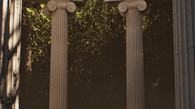 Sunlight filtering through lush green foliage illuminates ancient greek columns. A slow descending view reveals the classical ionic order architecture