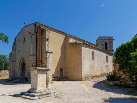 Historical monuments of M&eacute;nerbes in Luberon. Church of Saint Luke near Saint Saviour Gate, ancien protective ramparts, one of the two village entrances in mediaeval times