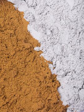 Kinetic sand texture brown and gray color with diagonal border close-up top view