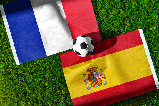 France vs Spain, Semifinals, national flags before international football match, football on green grass with stadium in the background, Arlington, July 14, 2026.