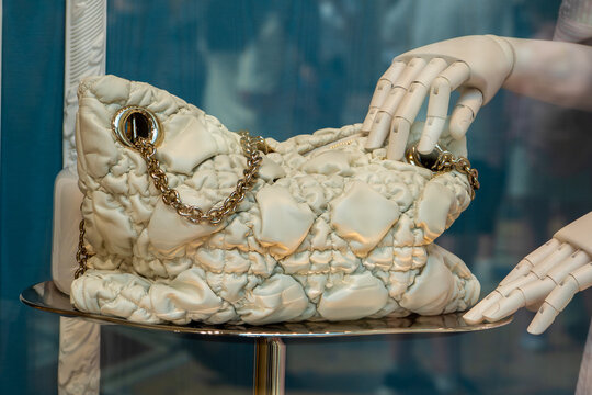 Christian Dior butter color Women's Metallic Medium Milly-La-Foret Bag Matelasse Quilted Leather Handbag with Gold Chain on a Mannequin Display in a Luxury Boutique. Milan, Italy - June 24, 2026