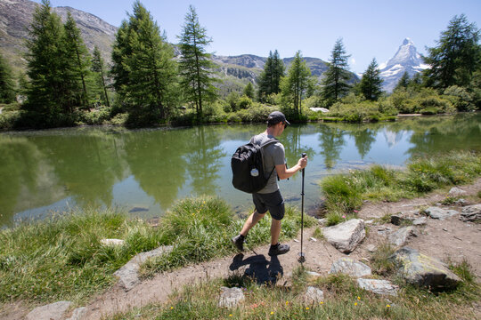 backpacker on hike Five Lakes Trail, Zermatt, Matterhorn, Switzerland