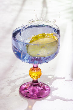 Colored glass wit water splash 
