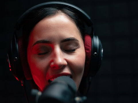 Woman singing in studio 