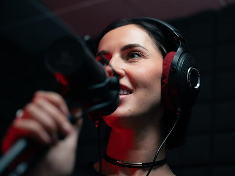 Excited artist recording song in studio 