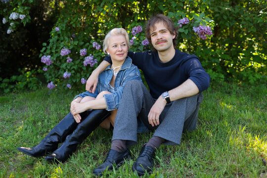 mother with older son walking spending time in the park