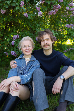 mother with older son walking spending time in the park