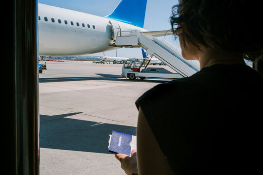 Passenger Prepares for Departure at the Airport With Passport in Hand