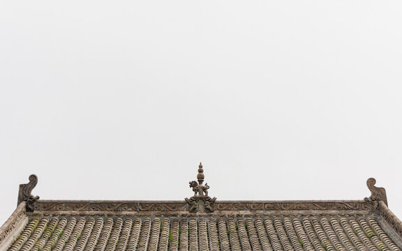 Ancient Chinese Temple Roof Ridge Under a Minimalist Sky.