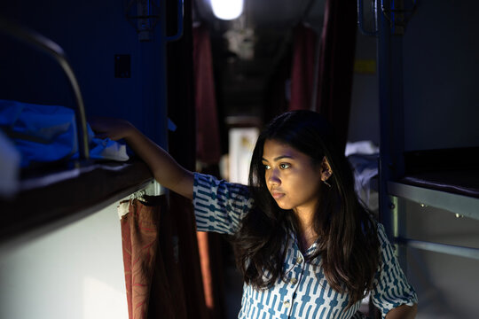Young Indian woman inside train