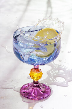 Colored glass wit water splash 
