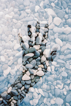Double Exposure: Pebbles and Anonymous Hand