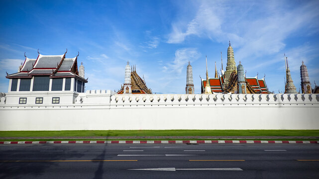 The Grand Palace in Bangkok, Thailand, on a bright, clear morning. The area in front of the palace embodies a tourism, Travel concept that highlights the urban lifestyle and rich history of Bangkok.