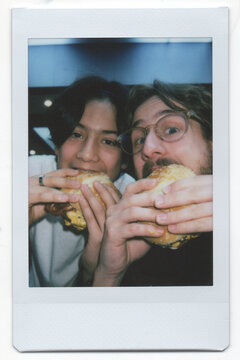 UGC Two Friends Enjoy Burgers at a Casual Eatery During Lunch Time