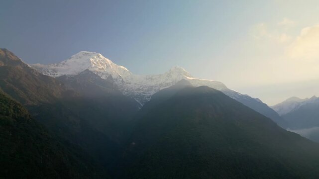 V Shaped Mountain Valley with Fishtail Peak and Misty Forest in Annapurna Nepal

