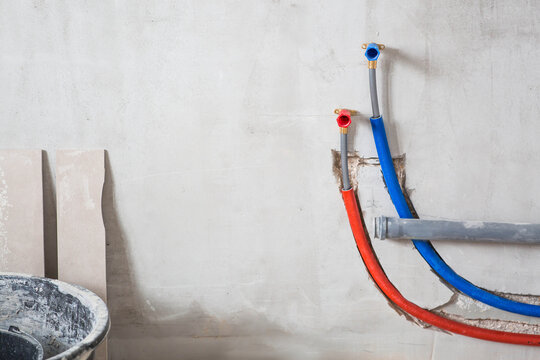 Water supply. Installation of cross-linked polyethylene pipes. The process of laying water pipes in a house. Plumbing. Repair.