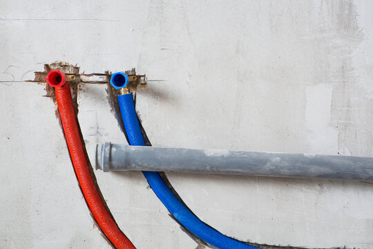 Water supply. Installation of cross-linked polyethylene pipes. The process of laying water pipes in a house. Plumbing. Repair.