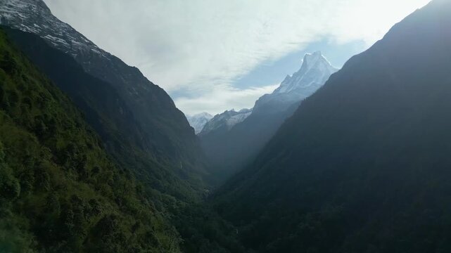 V Shaped Mountain Valley with Fishtail Peak and Misty Forest in Annapurna Nepal
