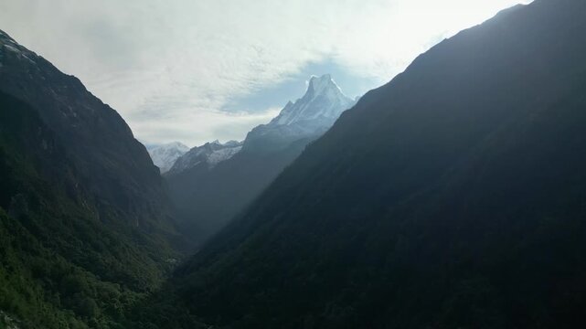 V Shaped Mountain Valley with Fishtail Peak and Misty Forest in Annapurna Nepal
