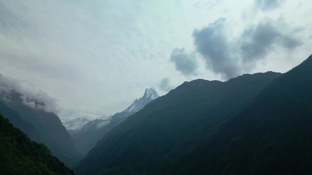 V Shaped Mountain Valley with Fishtail Peak and Misty Forest in Annapurna Nepal
