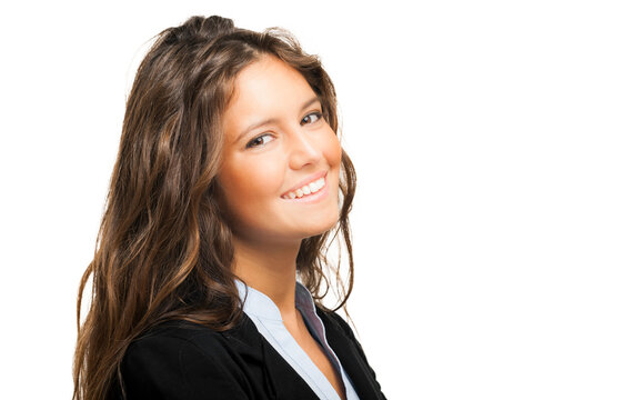 Professional young woman in a business suit smiling with a white