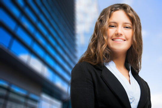 Confident young businesswoman in urban setting