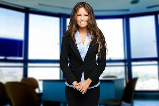 Confident young businesswoman in modern office