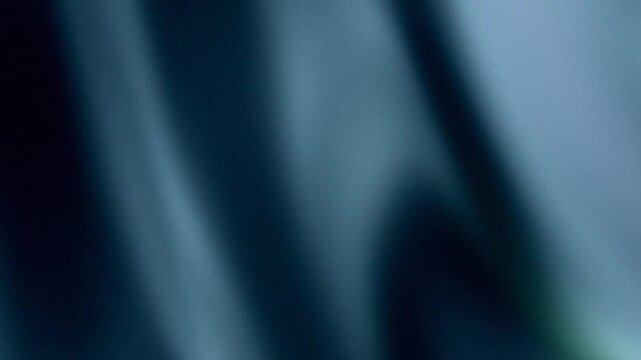 Abstract blue background with soft light shadows and grainy texture