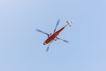 Rescue helicopter in flight. View from below. © Photopen