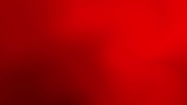Abstract red smoke or ink swirling in fluid motion