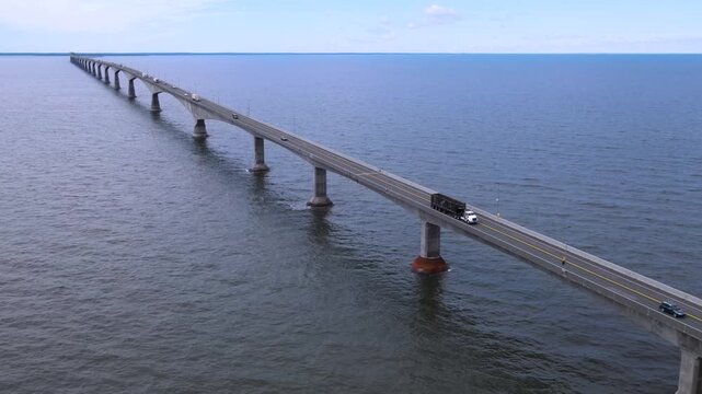 Aerial view of Confederation Bridge with commercial traffic in PEI Canada
