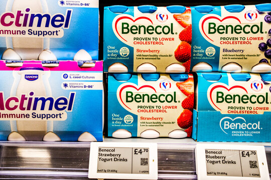 Supermarket dispaly of Benecol Cholesterol Lowering Yogurt Drinks And Actimel Immune Support Healthy Yogurt Drinks Close Up With No People