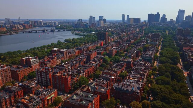 The renowned historic brownstone homes and red-brick Victorian row houses in Back Bay neighborhood. View on the Charles River in Boston, Massachusetts, USA.