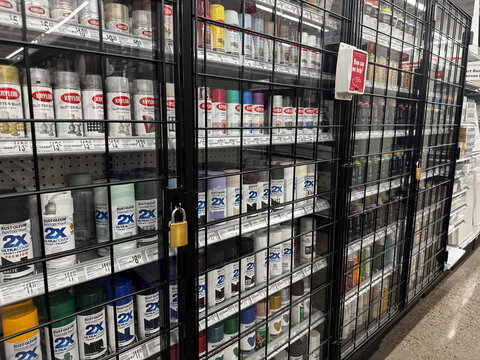 Mesa, Arizona - June 27, 2026: Display of spray paint behind a locked case at a Michaels store