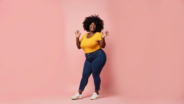 Full body African woman of plus size model dancing on pastel background