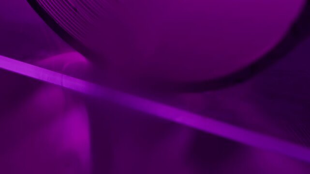 Fluorescent steam. Spill light smog. Defocused purple color bright round texture drip dazzle gleam flow on abstract art neon creative background.
