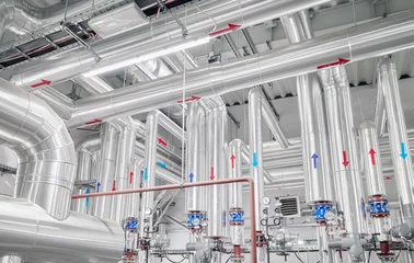 Piping in a district heating plant that uses renewable energy sources. © MaciejBledowski