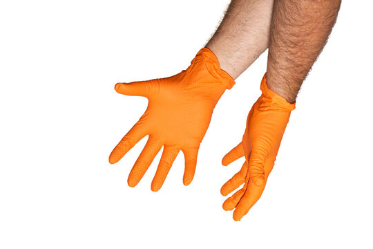 Hands reaching downward, wearing bright orange, textured nitrile gloves in front of white background