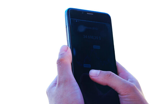 A close-up shot of a person holding a smartphone showing the current price of Bitcoin. The image is isolated on a white background, making it ideal for financial and technology-related designs.