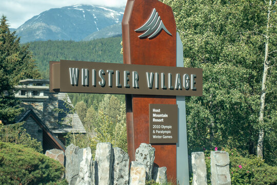 View of sign Welcome to Whistler with forest in the background. Vintage look.