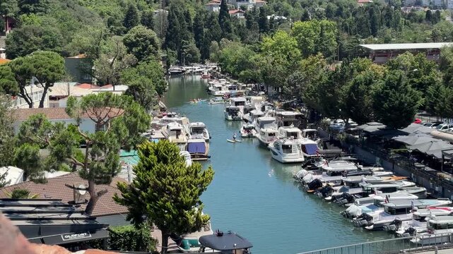 Boats and people canoeing on the Goksu River in Beykoz, Istanbul, Turkey.