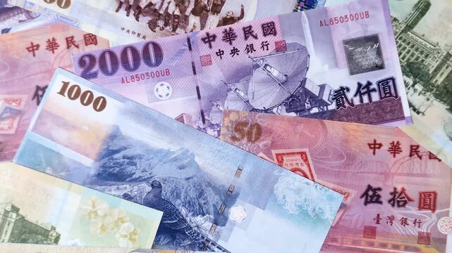 Taiwan, Taiwanese paper banknotes and coins, dollars of various denominations for trade and financial transactions. Taiwanese dollars as a business background for your design