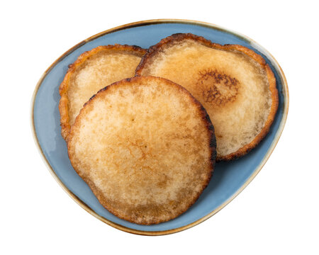 Close-up of traditional bengali sweet malpua pitha in a blue bowl isolated on transparent background