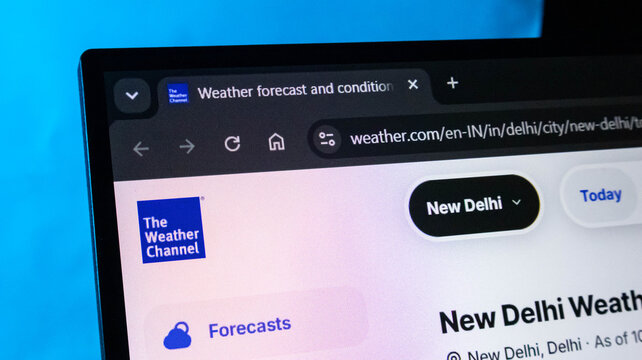 Weather Channel website on laptop. Weather forecast online. Meteorology on computer screen.