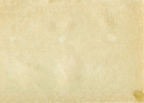 Vintage paper texture. Old stained paper background with copy space. Aged and yellowed paper.