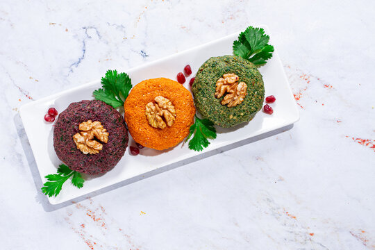assortment of Phali, three types, pumpkin, spinach and beetroot, Georgian dish, appetizer with nuts and spices, no people, homemade,