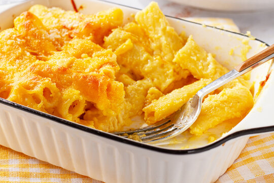 rigatoni macaroni with cheese, baked in a mold, homemade, sunlight, no people,