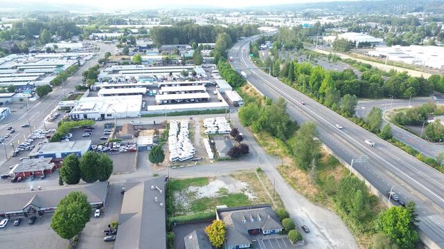 Logistics network centerstate route 167 borders storage clusters dominating Kent business topography. Multi level warehouse designs mirror suburban sprawl patterns, accented by summer canopy WA