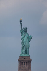 The Statue of Liberty, a colossal neoclassical sculpture on Liberty Island in New York Harbor, stands as a symbol of freedom and democracy. © Pete Niesen Photo