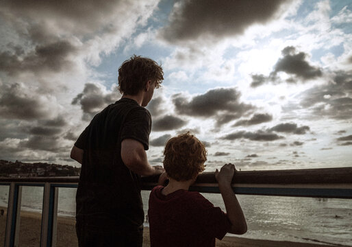 Brothers Standing at Beach Overlook